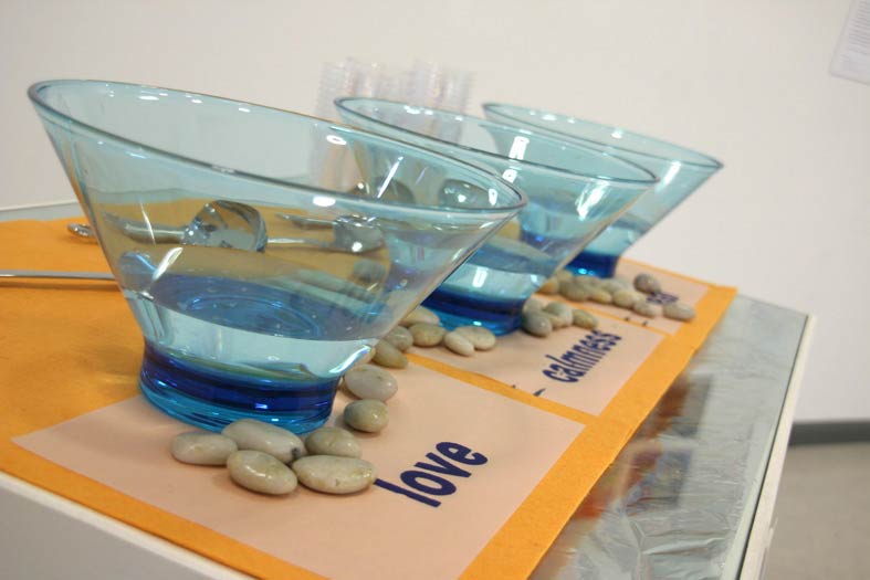 Installation Waterised Words (2007, water, kitchen bowls, printed text, pebble.) Image © Gil Dekel.
